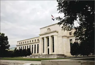  ??  ?? The Federal Reserve building in Washington, DC. The Fed has moved to inject much-needed cash on a temporary basis, but if left unchecked, the flood of supply in coming months and years could ultimately result in higher borrowing costs for the US.