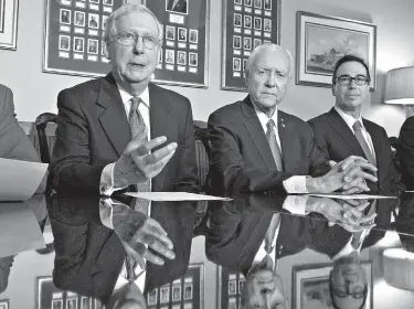  ?? AP Photo/J. Scott Applewhite ?? From left, Senate Majority Leader Mitch McConnell, R-Ky., Senate Finance Committee Chairman Orrin Hatch, R-Utah, and Treasury Secretary Steven Mnuchin speak to reporters Thursday on Capitol Hill in Washington. The press conference addressed the...