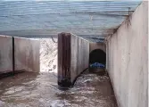  ??  ?? ABOVE: Water flows through a division, which separates one-third of the water to the Acequia del Monte in Talpa.