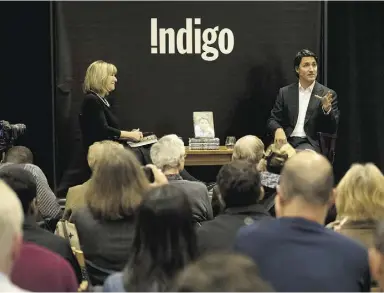  ?? Peterj. Thompson/ National Post ?? Federal Liberal leader Justin Trudeau speaks with Indigo CEO Heather Reisman
at the company’s 55 Bloor St. location on Monday in Toronto.