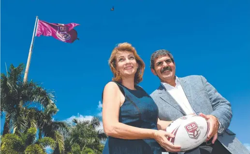  ??  ?? Mayor Jenny Hill and then QRL chairman Peter Betros with the giant Maroons flag flying over the Douglas roundabout in 2016.