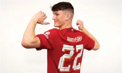  ?? Photograph: Nick Taylor/Liverpool FC/Getty Images ?? The new Liverpool signing Calvin Ramsay is unveiled by the club.