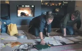  ?? ?? Film still showing Justin and Dominic Hardy sifting through unpublishe­d documents of their father.