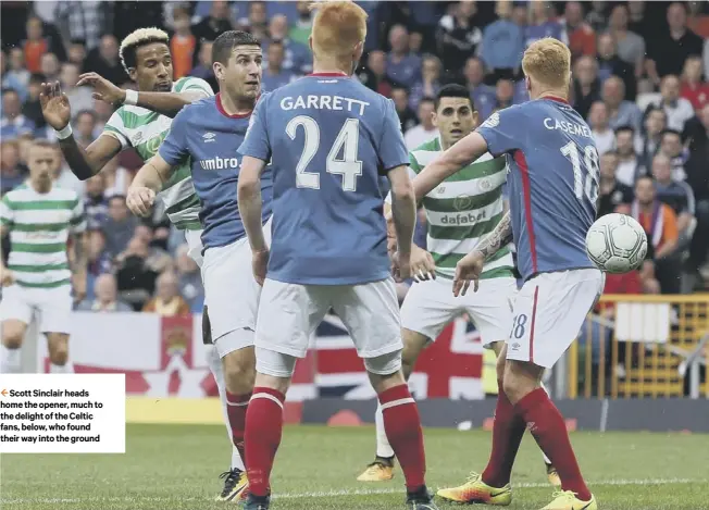  ??  ?? Scott Sinclair heads home the opener, much to the delight of the Celtic fans, below, who found their way into the ground