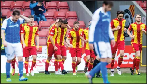  ??  ?? Partick Thistle striker Miles Storey takes the acclaim from his teammates after his goal sent the Jags on their way to a 1-0 victory over St Johnstone