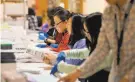  ?? Jessica Christian / The Chronicle ?? Election workers sorting through mail ballots in San Francisco.