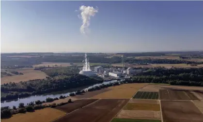  ?? Photograph: Michael Probst/AP ?? The nuclear power plant at Neckarwest­heim. Scholz’s government has refused to reverse its long-term plan to close down the last remaining atomic generators by the end of this year.