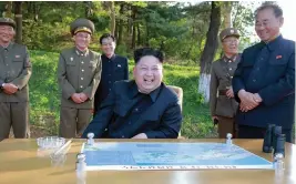  ?? — AP ?? North Korean leader Kim Jong-un watches the test launch of solid fuel Pukguksong-2, a medium-to-long range ballistic missile, at an undisclose­d location in North Korea.