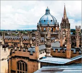  ?? CAMERON HEWITT/RICK STEVES’ EUROPE PHOTOS ?? At left, punting on the River Cam is one of the best ways to see the University of Cambridge. At right, Oxford’s skyline is peppered with spires and domes from its venerable colleges.