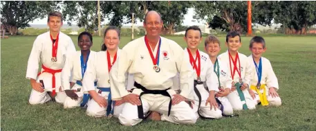  ??  ?? Hluhluwe JKA karate students who quali ed for the KZN team are Tristan Goddard (orange belt), Aphile Makamo (blue belt), Zana Spencer (green belt), Sensei Warren McCall (black belt), Tristan Davies (brown belt), Cody Spencer (purple belt), Declan...