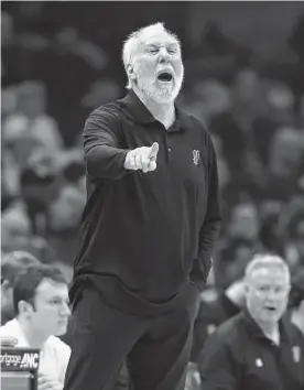  ?? Ron Schwane/associated Press ?? Spurs head coach Gregg Popovich was none to happy with his team’s latest loss at Charlotte, their franchise-record 14th consecutiv­e defeat.