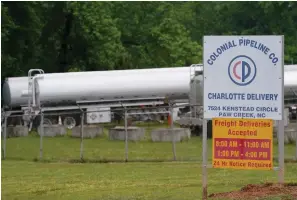  ?? Associated Press ?? ■ Tanker trucks are parked on May 12 near the entrance of Colonial Pipeline Company in Charlotte, N.C. The operator of the nation’s largest fuel pipeline has confirmed it paid $4.4 million to a gang of hackers who broke into its computer systems. That’s according to a report from the Wall Street Journal. Colonial Pipeline’s CEO Joseph Blount told the Journal that he authorized the payment after the ransomware attack because the company didn’t know the extent of the damage.