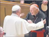  ?? THE WASHINGTON POST ?? Pope Francis, left, reaches out to Cardinal Theodore McCarrick during services in Washington, D.C., in 2015.