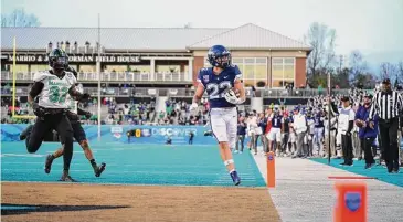  ?? UConn athletics/Contribute­d photo ?? UConn’s Victor Rosa scores a touchdown against Marshall in the Myrtle Beach Bowl.