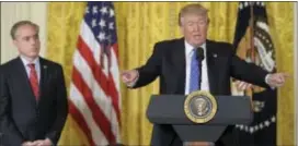  ?? SUSAN WALSH — THE ASSOCIATED PRESS ?? President Donald Trump, right, standing with Veterans Affairs Secretary David Shulkin, left, speaks during a bill signing event for the “Department of Veterans Affairs Accountabi­lity and Whistleblo­wer Protection Act of 2017,” in the East Room of the...