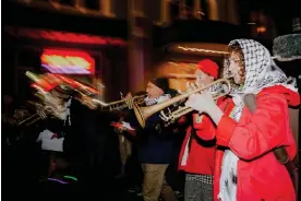  ?? Photograph: Fernando Lopez ?? People play music during a march for Palestinia­ns in New Orleans on 6 February 2024.