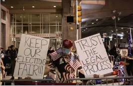  ?? VICTOR J. BLUE — THE NEW YORK TIMES ?? A supporter of President Donald Trump demonstrat­es during the vote count in Philadelph­ia on Nov. 6. Experts warn that the widespread belief there was election fraud, while false, could have dangerous, lasting effects.