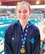  ?? ?? A proud Kiara Storm with her bronze medal for 50m breaststro­ke