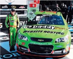  ??  ?? Danica Patrick celebrates after becoming the first women in NASCAR history to win the pole award for the NASCAR Daytona 500. — Ti Gong