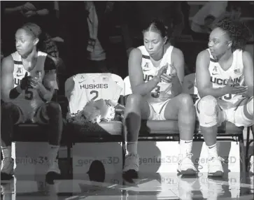  ?? Maddie Meyer Getty Images ?? A JERSEY TO honor Gianna Bryant sits on the Connecticu­t bench before the team’s game against the U.S. women’s national team. The 13-year-old daughter of Kobe Bryant wanted to play basketball for the university.