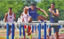  ?? STAFF PHOTO BY DOUG STRICKLAND ?? McCallie’s Hakim McMorris is out ahead before a tumble over the final hurdle set him back in the TSSAA Division II 110-meter-hurdles race Friday at the Middle Tennessee State University track.