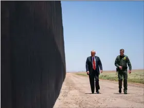  ?? (AP/Evan Vucci) ?? U.S. Border Patrol chief Rodney Scott gives President Donald Trump a tour of a section of the border wall Tuesday in San Luis, Ariz.