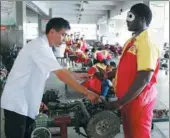  ??  ?? Sergio Cosby Thompson from Ghana learns motor repairs.