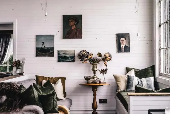  ??  ?? CHAPTER & VERSE Sarah’s skilled styling is key to the cottage’s charm; “I like to create spaces that tell stories,” she says. This nook by the bay window is furnished with plump textured cushions; artwork picked up on her travels, on Etsy and at...