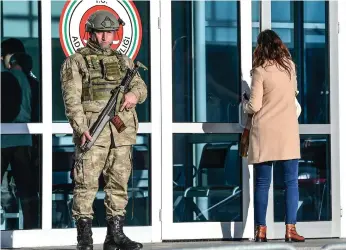  ?? AFP, AP ?? Security was tight at the court in Silivri district in Istanbul on the opening day of the trial of Abdulkadir Masharipov, right, who confessed to killing 39 people at a nightclub