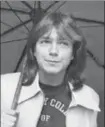  ?? ELLIDGE, GETTY IMAGES ?? David Cassidy in London with an umbrella in 1974.