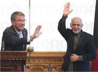  ??  ?? KABUL: Afghan President Ashraf Ghani (right) and US Defense Secretary Ash Carter (left) wave after a press conference at presidenti­al palace in Kabul yesterday. —AP