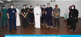  ??  ?? Minister of Health Sheikh Dr Basel Al-Sabah poses with health ministry staff.