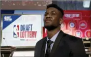  ?? CHARLES REX ARBOGAST — THE ASSOCIATED PRESS ?? Arizona’s DeAndre Ayton poses for a portrait before the NBA basketball draft lottery Tuesday in Chicago.