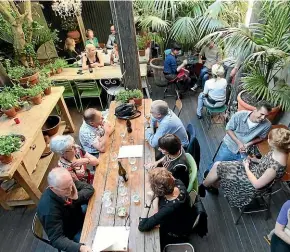  ??  ?? The outdoor courtyard of Olive restaurant on Wellington’s Cuba St is usually full of weekend brunchers.