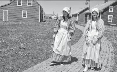  ?? SHARON MONTGOMERY-DUPE/CAPE BRETON POST ?? Interprete­rs Rebecca Harris, left, 22, a Cape Breton University student, and Jillian MacKeigan, 19, a Nova Scotia Community College student, stroll through the Miners’ Village at the Cape Breton Miners’ Museum in Glace Bay. The museum is looking for...