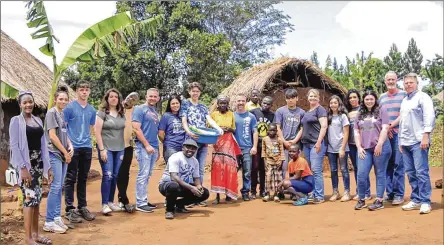  ?? CONTRIBUTE­D PHOTOS ?? The team from Impact Nations visits Uganda. They are shown with a team from Uganda. Left to right: Catherine Alleluyah, Teylyn Briggs, Jon Battles, Oriah Briggs, Jonathan Kasagga, Jeffrey Battles, Tiffany Battles, Zion Combs, villager, Brag Riga, villager, Kenneth Bugembe, Alek Hopper, Pam Hopper, Zoee Briggs, Jodie Briggs, Claire Curtis, David Cornett, Mike Hopper. Up front, kneeling: David Mugabi and Rachel Asaba.