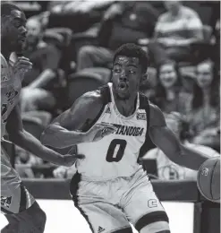  ?? PHOTO BY BRYANT HAWKINS ?? UTC’s Makale Foreman drives to the basket against UT-Martin’s Darius Thompson on Saturday at McKenzie Arena. Foreman scored 18 points.