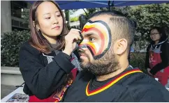  ?? FRANCIS GEORGIAN/PNG ?? Tracey gets Nav’s game face on ahead of the Canucks’ season opener Wednesday at Rogers Arena. Fans were not disappoint­ed in the outcome.