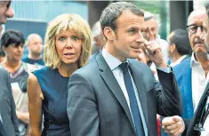  ??  ?? ‘Mozart of the Elysée’: economy minister Emmanuel Macron and his wife Brigitte