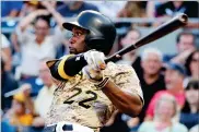  ?? AP PHOTO BY GENE J. PUSKAR ?? In this 2017 file photo, Pittsburgh Pirates' Andrew Mccutchen watches his Rbi-single off Cincinnati Reds starting pitcher Sal Romano during the third inning of a baseball game in Pittsburgh.