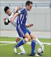  ?? DAX MELMER/The Windsor Star ?? Windsor’s Christian Mayorga, left, battles UOIT’s Jordan Harvey
Sunday during the Lancers’ 2-0 victory at Alumni Field.