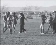  ?? MERISA JENSEN/Valley Press ?? GOOD JOB — Paraclete girls soccer coach Tracey Hill, center, high-fives her players after tying Sierra Canyon 0-0 in the regular-season finale on Thursday.