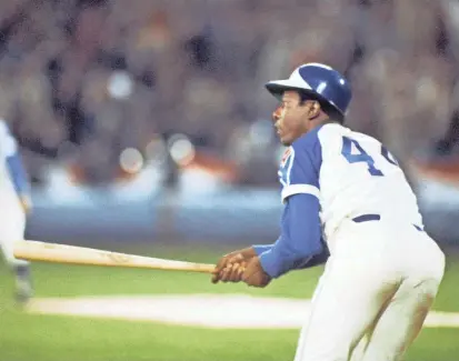  ?? MANNY RUBIO/USA TODAY SPORTS ?? Hank Aaron hits his 715th career home run off Dodgers pitcher Al Downing, breaking Babe Ruth’s record in Atlanta on April 8, 1974.