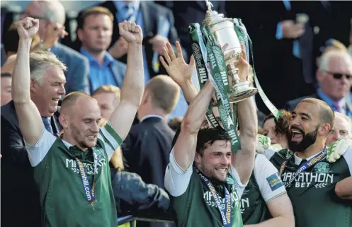  ??  ?? 2 Lewis Stevenson lifts the Scottish Cup at Hampden in 2016 after Hibs’ dramatic victory over Rangers in the final.