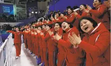  ?? Jae C. Hong / Associated Press ?? A North Korean cheer group supports the home team in the preliminar­y round of the women’s hockey tournament.