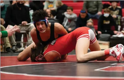  ?? CHRIS SPONAGLE — SPECIAL TO THE READING EAGLE ?? Berks Catholic’s Marvin Armistead, left, defeats Wilson’s Aiden Dojan in the 132-pound championsh­ip match at the BCIAA Individual Tournament and helps the Saints win the team title.