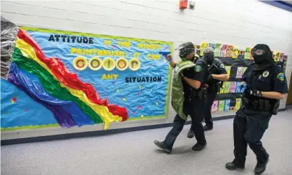  ?? Photograph: Dougal Brownlie/AP ?? Police officers take part in active shooter response training exercise at Fountain middle school in Fountain, Colorado, in June 2017.