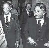  ?? CP PHOTO/FRED CHARTRAND ?? Finance Minister Allan MacEachen, right, and Prime Minister Pierre Trudeau in the House of Commons during budget night, Nov 12, 1981.