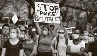  ?? Steve Gonzales / Staff photograph­er ?? Protesters at a Wednesday rally in Houston call for changes in the city budget designed to eliminate police misconduct.