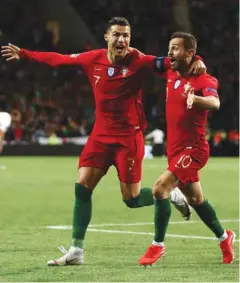  ?? ?? Despite failing to find the net in his last nine matches for Portugal, Cristiano Ronaldo (left) still has the backing of his teammates, says Bernardo Silva.
